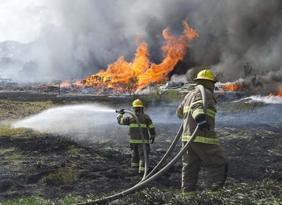Fighting farm fire in the Rural Municipality of Cornwallis